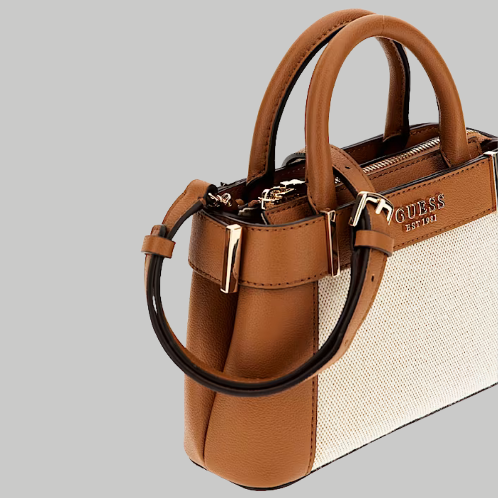 Brown handbag with beige accents on a gray background